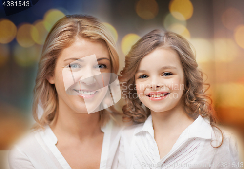 Image of happy mother and little daughter portrait