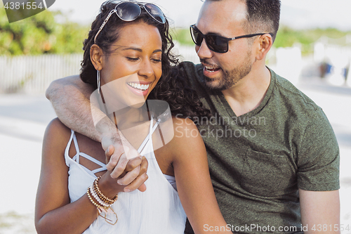 Image of Beautiful couple embracing on shoreline