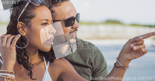 Image of Stylish diverse couple chilling outside