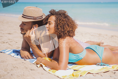 Image of Couple enjoying the music on beach