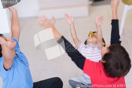 Image of young boys having fun on the floor