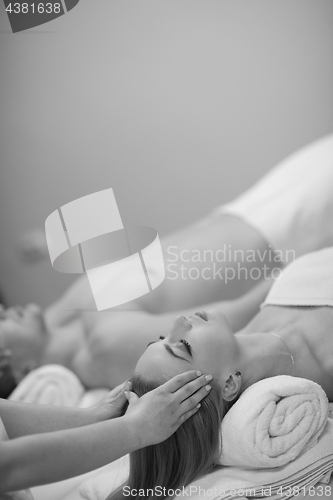 Image of couple enjoying head massage at the spa