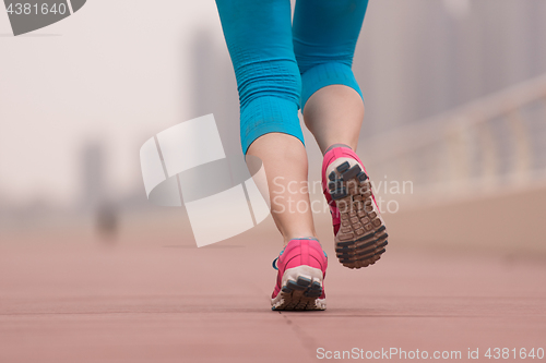 Image of woman running on the promenade