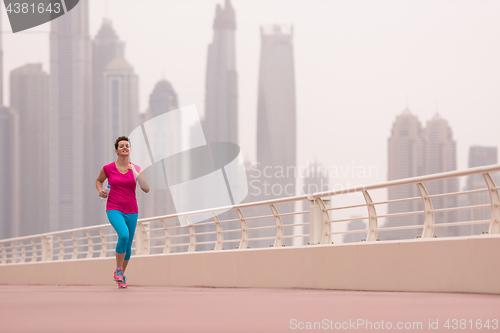 Image of woman running on the promenade