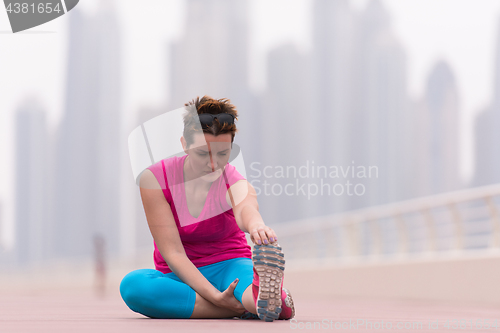 Image of woman stretching and warming up