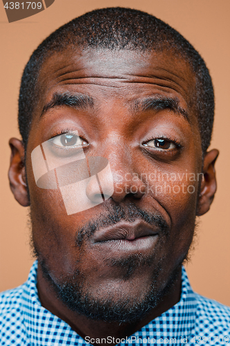 Image of Positive thinking African-American man on brown background