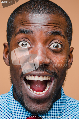 Image of The portrait of handsome young surprised black african man