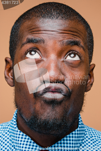 Image of Positive thinking African-American man on brown background