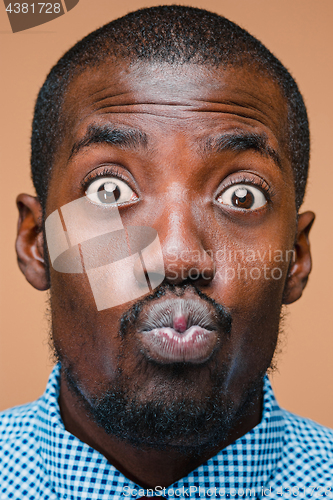 Image of Positive thinking African-American man on brown background