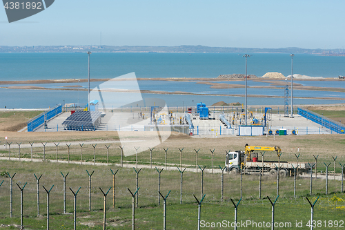 Image of Taman, Russia - 15 April 2017: A platform with communications in front of the bridge that is being built across the Kerch Strait, from the tamani side, as of April 2017