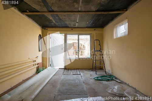 Image of Repair in a private house, view of the entrance to the premises from the side of the street and the window