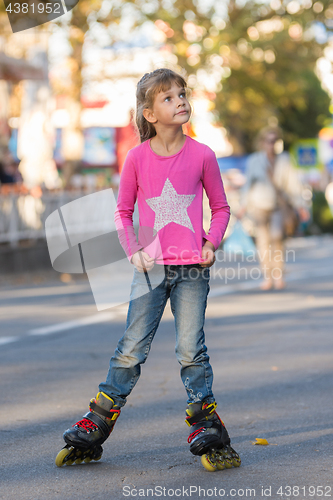 Image of Six-year-old girl roller-skating