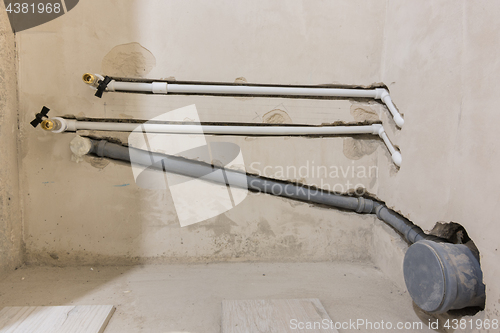 Image of Water and sewage piping for toilet and washbasin installation