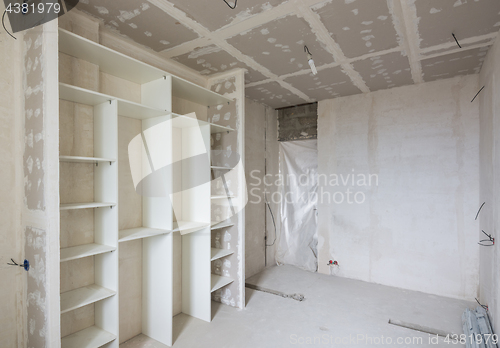 Image of Interior of the renovated room with built-in wardrobe