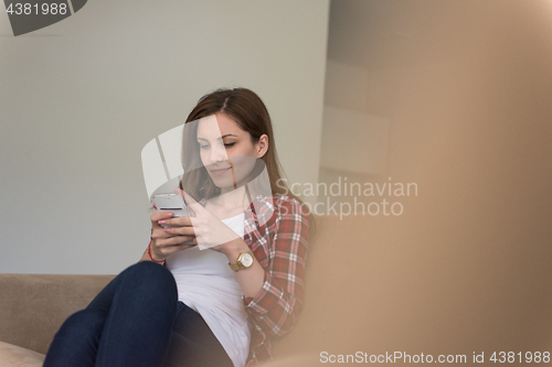 Image of woman using mobile phone