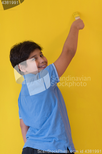 Image of Portrait of a happy young boy painter