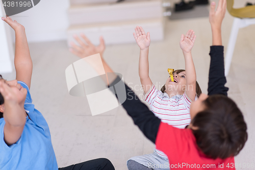 Image of young boys having fun on the floor