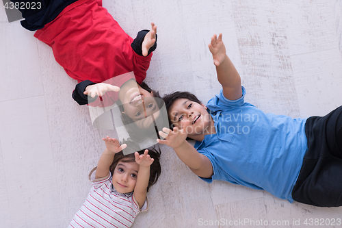 Image of young boys having fun on the floor