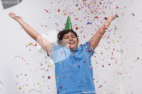 Image of kid blowing confetti