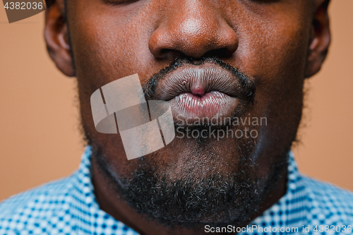 Image of Positive thinking African-American man on brown background