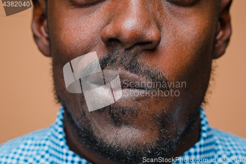 Image of Positive thinking African-American man on brown background