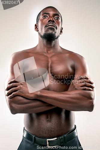 Image of young afro american with naked torso isolated
