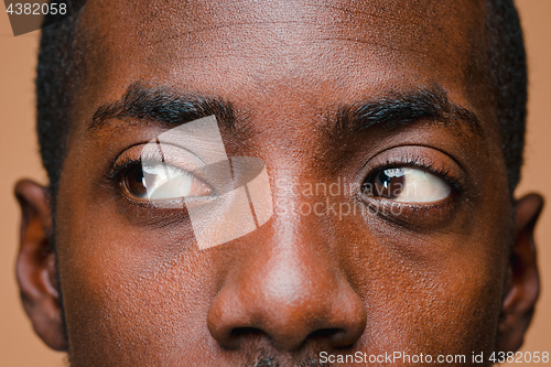 Image of Positive thinking African-American man on brown background