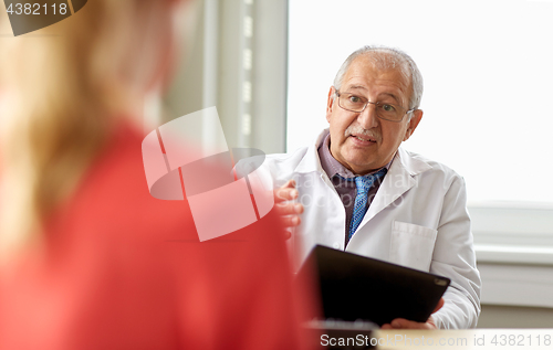 Image of senior doctor and patient at womens health clinic