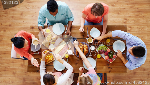 Image of group of people having breakfast at table