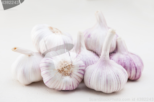 Image of garlic bulbs on white background