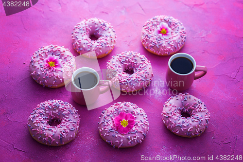 Image of delicious pink donuts