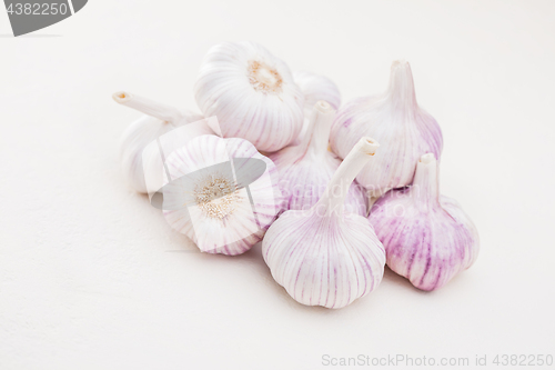 Image of garlic bulbs on white background