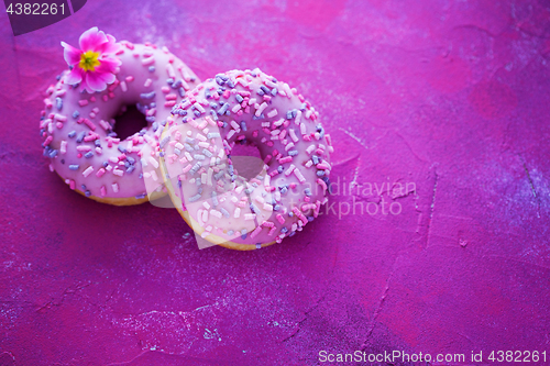 Image of delicious pink donuts