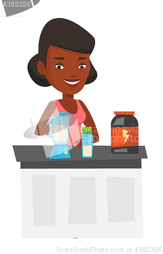 Image of Young woman making protein cocktail.