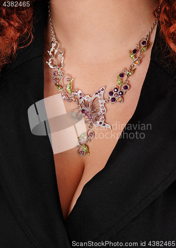 Image of Closeup of necklace on a woman