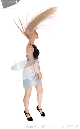 Image of Blond woman flying her long hair