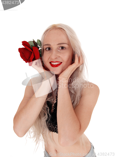 Image of Smiling woman in portrait with red rose