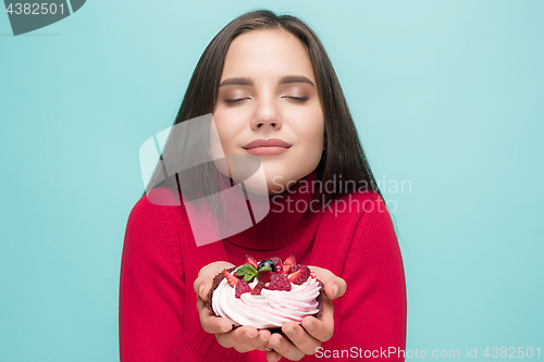 Image of Beautiful women holding small cake. Birthday, holiday.