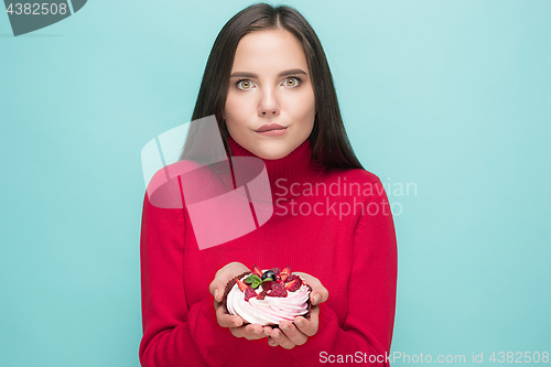 Image of Beautiful women holding small cake. Birthday, holiday.