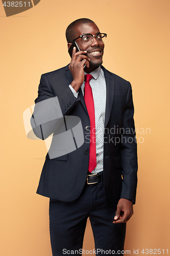 Image of Young african business man on the phone