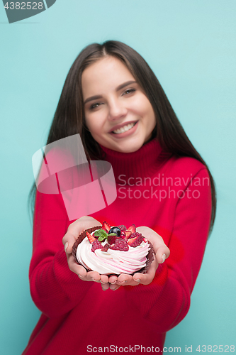 Image of Beautiful women holding small cake. Birthday, holiday.