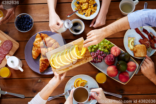 Image of group of people having breakfast at table