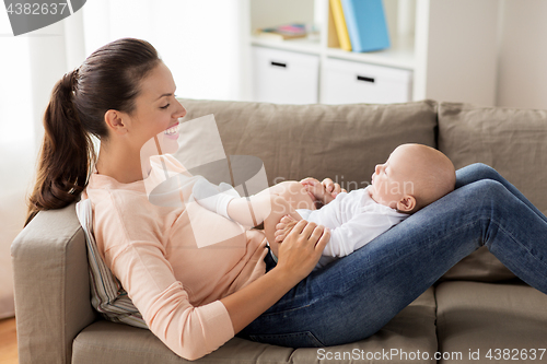 Image of happy mother with little baby boy at home