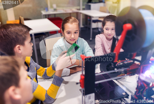 Image of happy children with 3d printer at robotics school