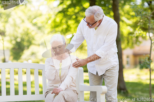 Image of senior woman suffering from headache outdoors