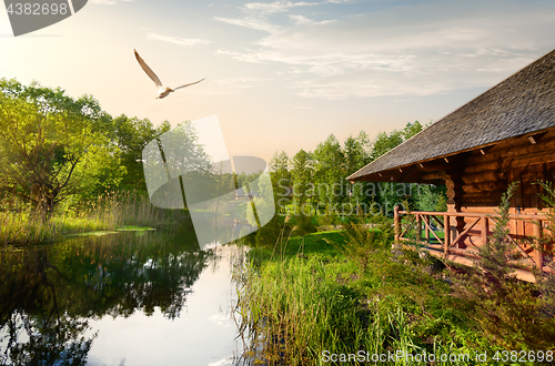 Image of Wooden house at sunrise