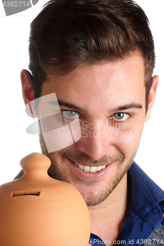 Image of Young man holding a clay moneybox