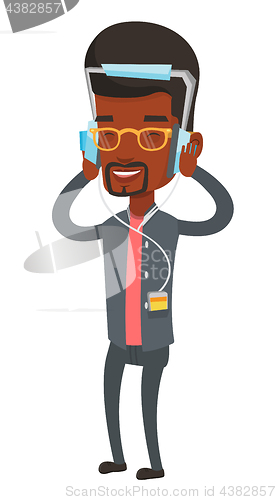 Image of Young man in headphones listening to music.