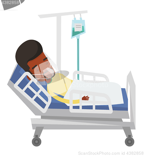 Image of Patient lying in hospital bed with oxygen mask.