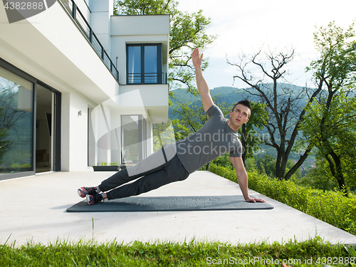Image of man doing morning yoga exercises